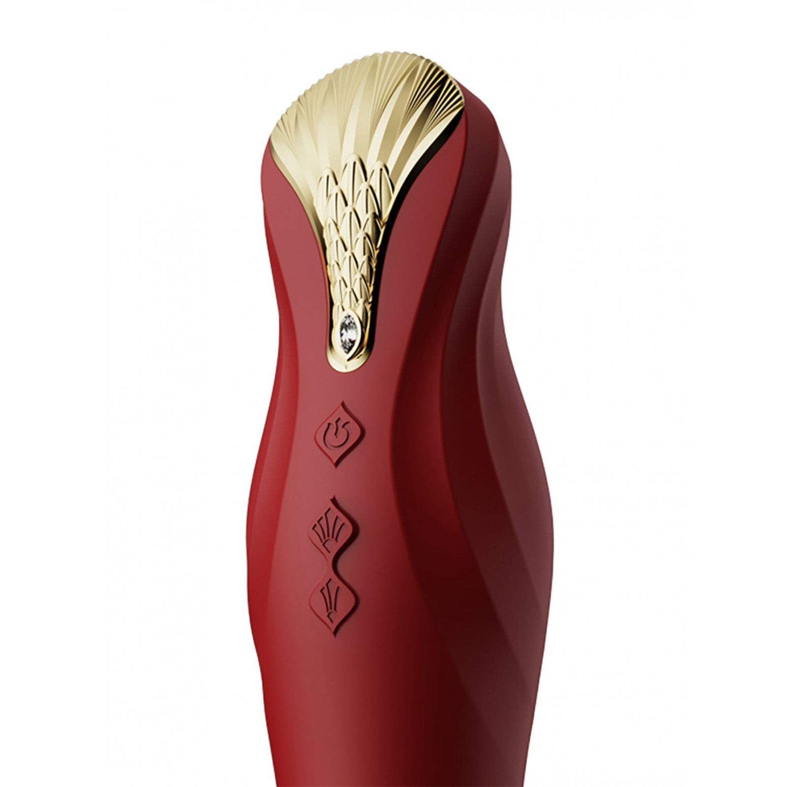 Primo piano del vibratore rosso. Testa dorata con pulsanti di controllo. Su sfondo bianco.