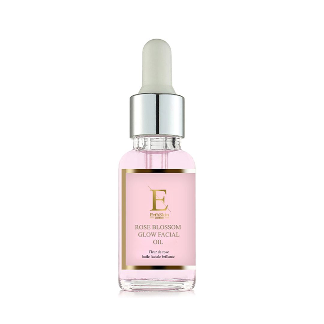 Flacone in vetro con contagocce, contenente olio viso rosato. Etichetta 'Rose Blossom Glow Facial Oil'.