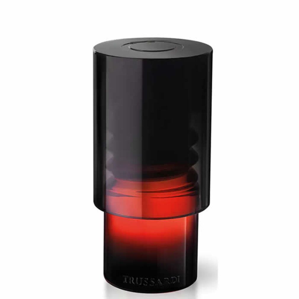 Flacone nero sfumato rosso. Il flacone ha una forma cilindrica con un tappo nero.