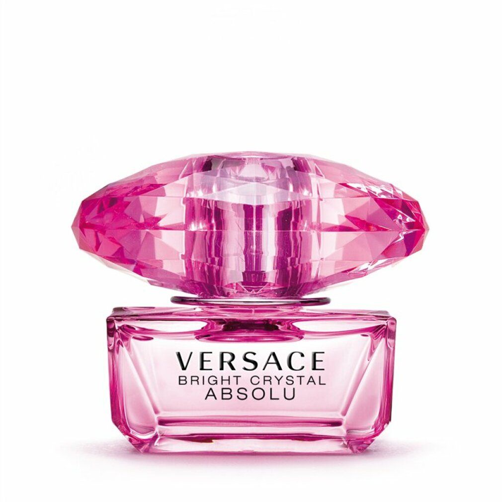 Flacone rosa con tappo di cristallo. Scritta: VERSACE BRIGHT CRYSTAL ABSOLU.