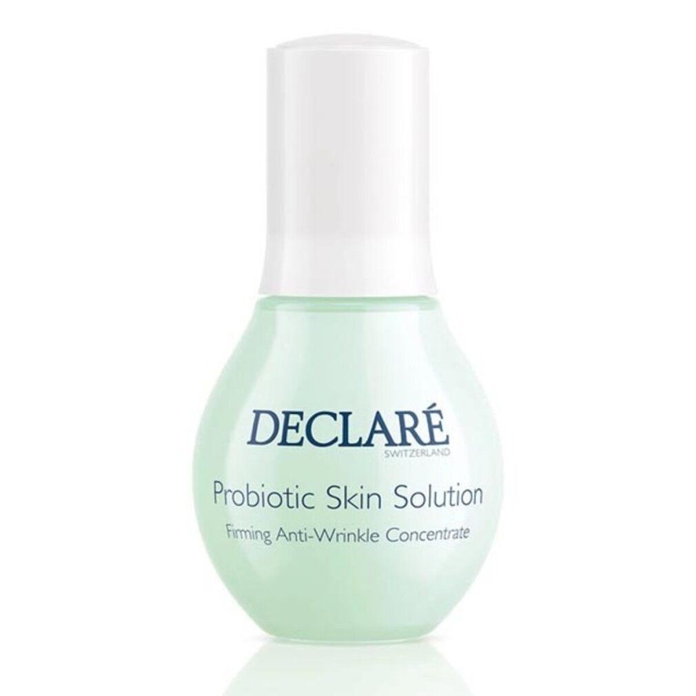 Flacone verde con tappo bianco. Scritta: DECLARÉ SWITZERLAND, Probiotic Skin Solution, Firming Anti-Wrinkle Concentrate.