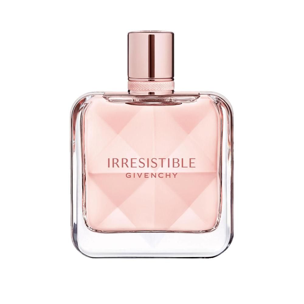 Flacone di profumo rosa. Forma quadrata con design sfaccettato. Scritta: Irresistible Givenchy.