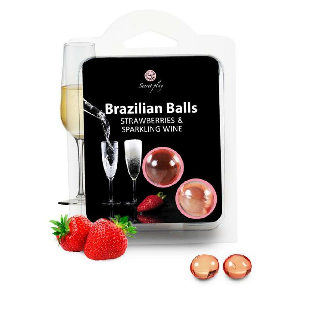 Confezione con due sfere trasparenti. Testo: Brazilian Balls, Strawberries & Sparkling Wine. Fragole e calici accanto. Marchio Secret Play.