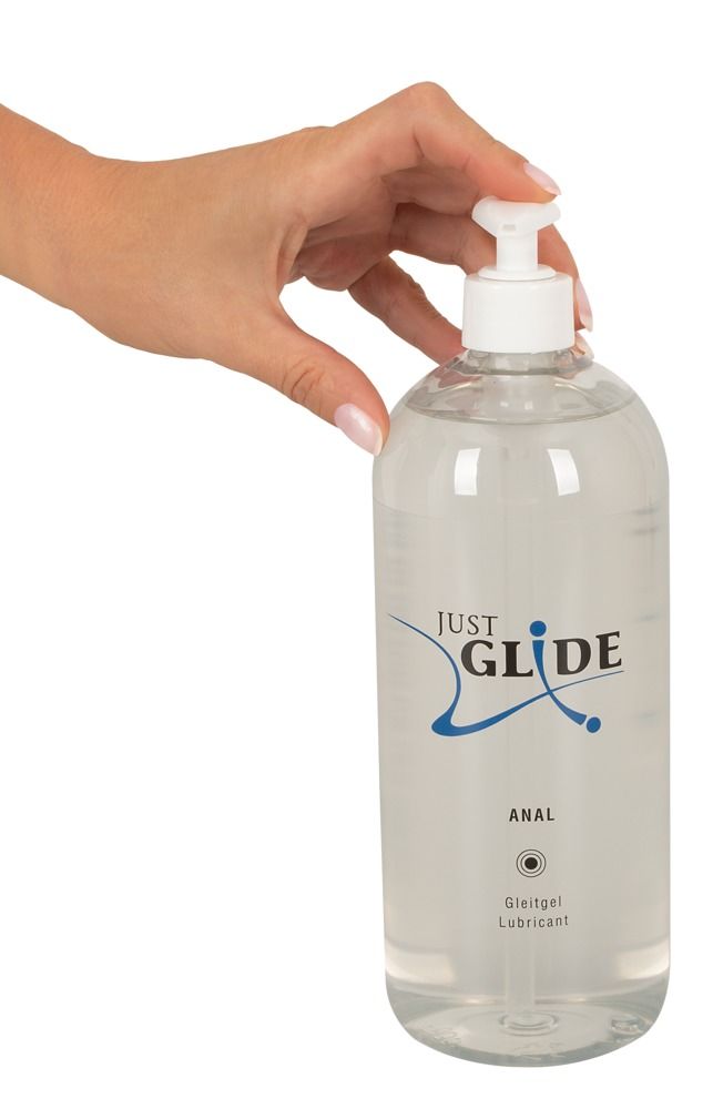 Mano che tiene un flacone trasparente con dosatore. Scritta: JUST GLIDE ANAL. Gleitgel Lubricant.