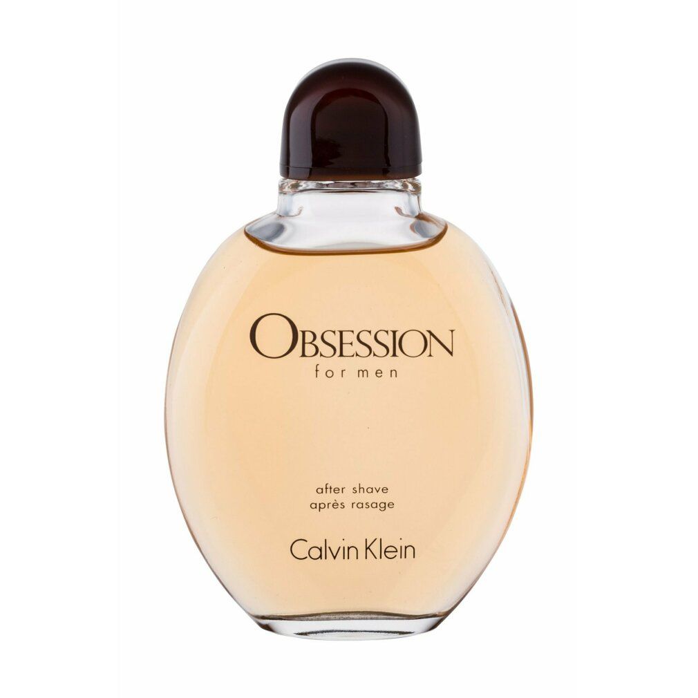 Flacone rotondo con tappo marrone. Scritta: Obsession for men, after shave, Calvin Klein.