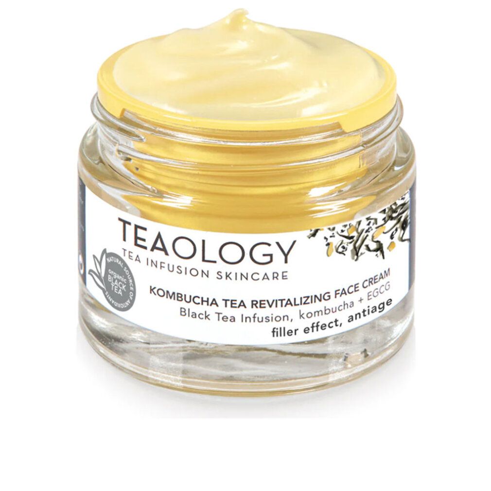Vasetto di vetro con crema giallastra. Scritta: Teaology, Kombucha Tea Revitalizing Face Cream. Tè nero, kombucha + EGCG.
