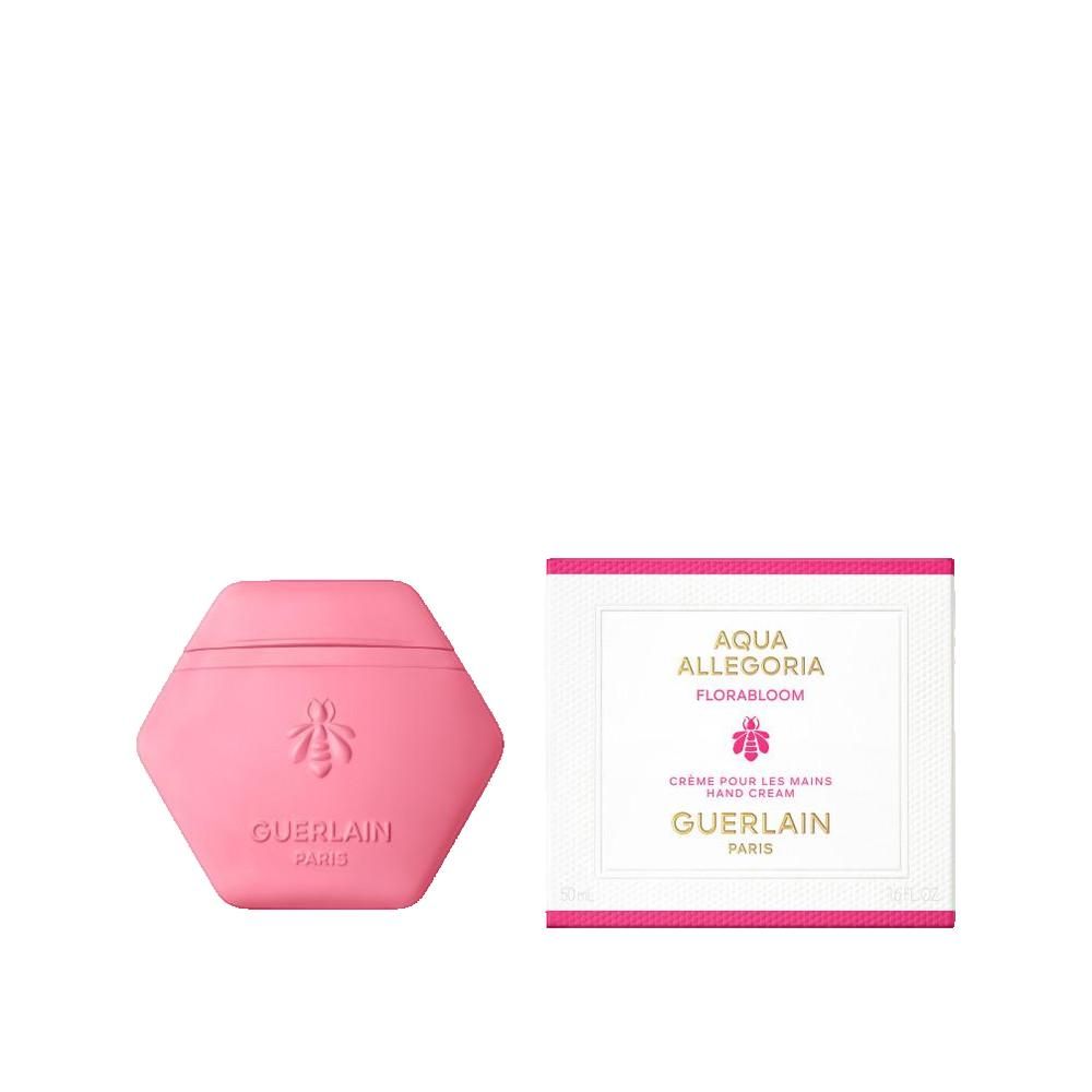 Contenitore rosa esagonale per crema mani, logo ape e scritta. Accanto, scatola bianca con testo.