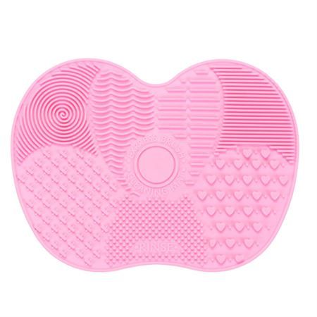 Tappetino rosa in silicone per la pulizia dei pennelli da trucco, con diverse texture.