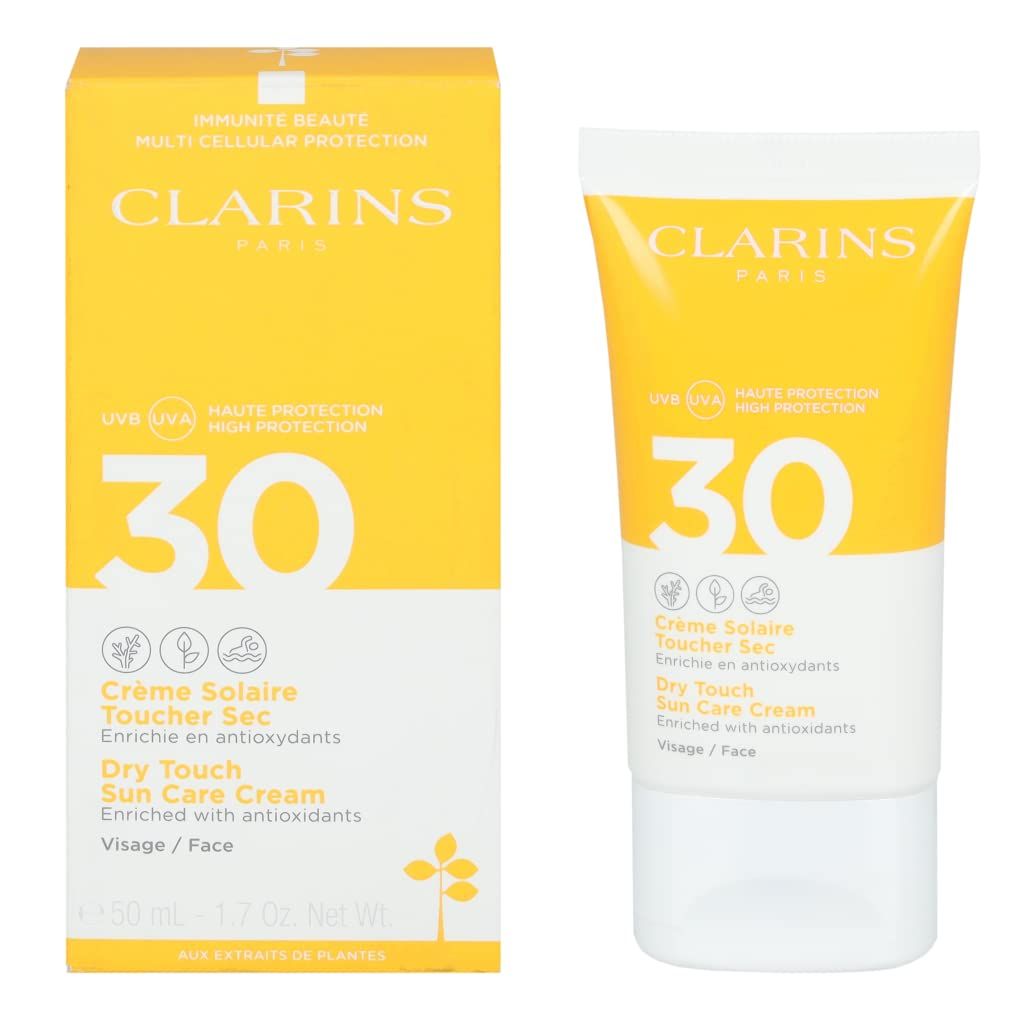 Clarins Crème Solaire Visage UVA/UVB 30. Scatola e tubo gialli. Scritte: 30, Crème Solaire, Dry Touch, Visage/Face, 50 ml.