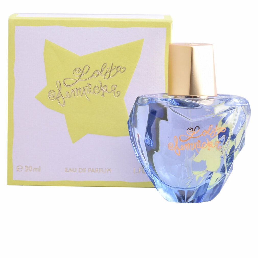Lolita Lempicka Eau de Parfum Spray e confezione. Flacone blu, a forma di cuore, tappo dorato. Confezione con stella gialla e scritta.