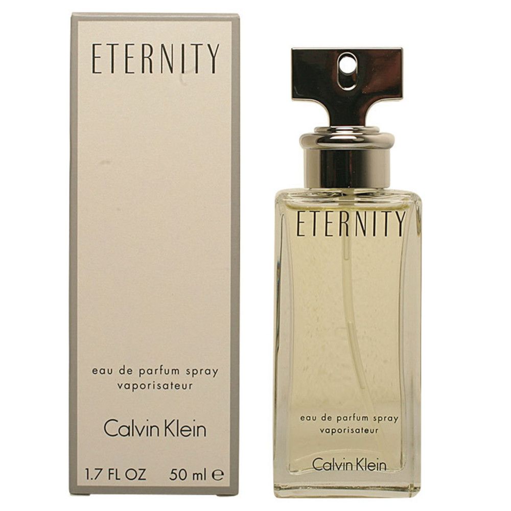 Flacone di profumo rettangolare con tappo argentato e scatola. Scritta: Eternity, Calvin Klein.