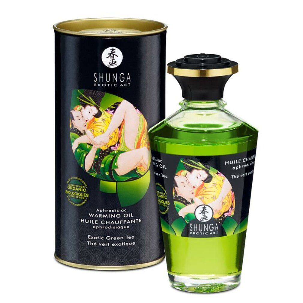 Olio da massaggio Shunga Green Tea, bottiglia e scatola. Olio verde, etichetta con baci.