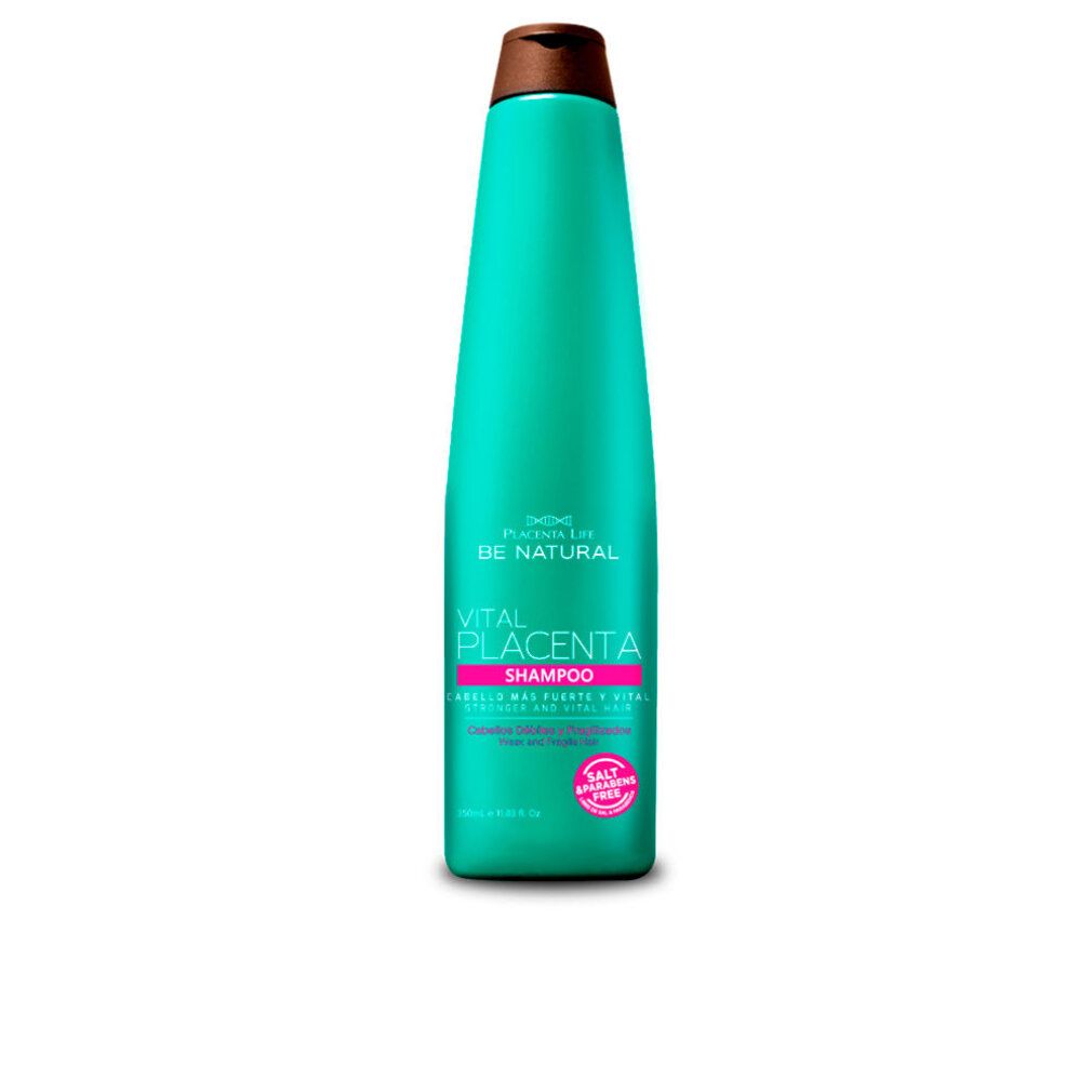 Flacone turchese con tappo marrone. Scritta: Be Natural, Vital Placenta Shampoo. Etichetta rosa con testo.