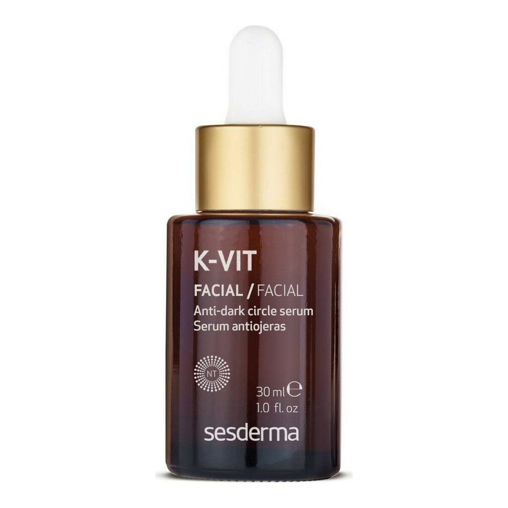 Flacone di vetro marrone con tappo dorato e pipetta. Scritta: K-Vit Facial, siero anti-occhiaie. Sesderma. 30 ml.