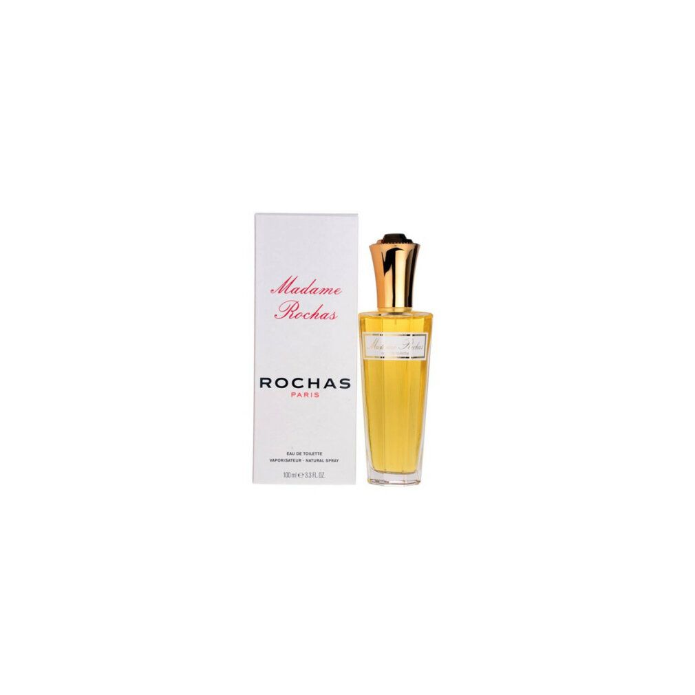 Flacone di profumo accanto alla confezione. Flacone con tappo dorato. Scritta: Madame Rochas Eau de Toilette.