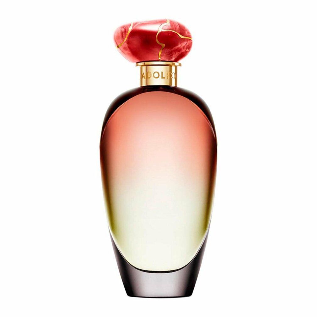 Flacone di profumo con sfumatura rosa-giallo. Tappo rosso. Collo dorato.