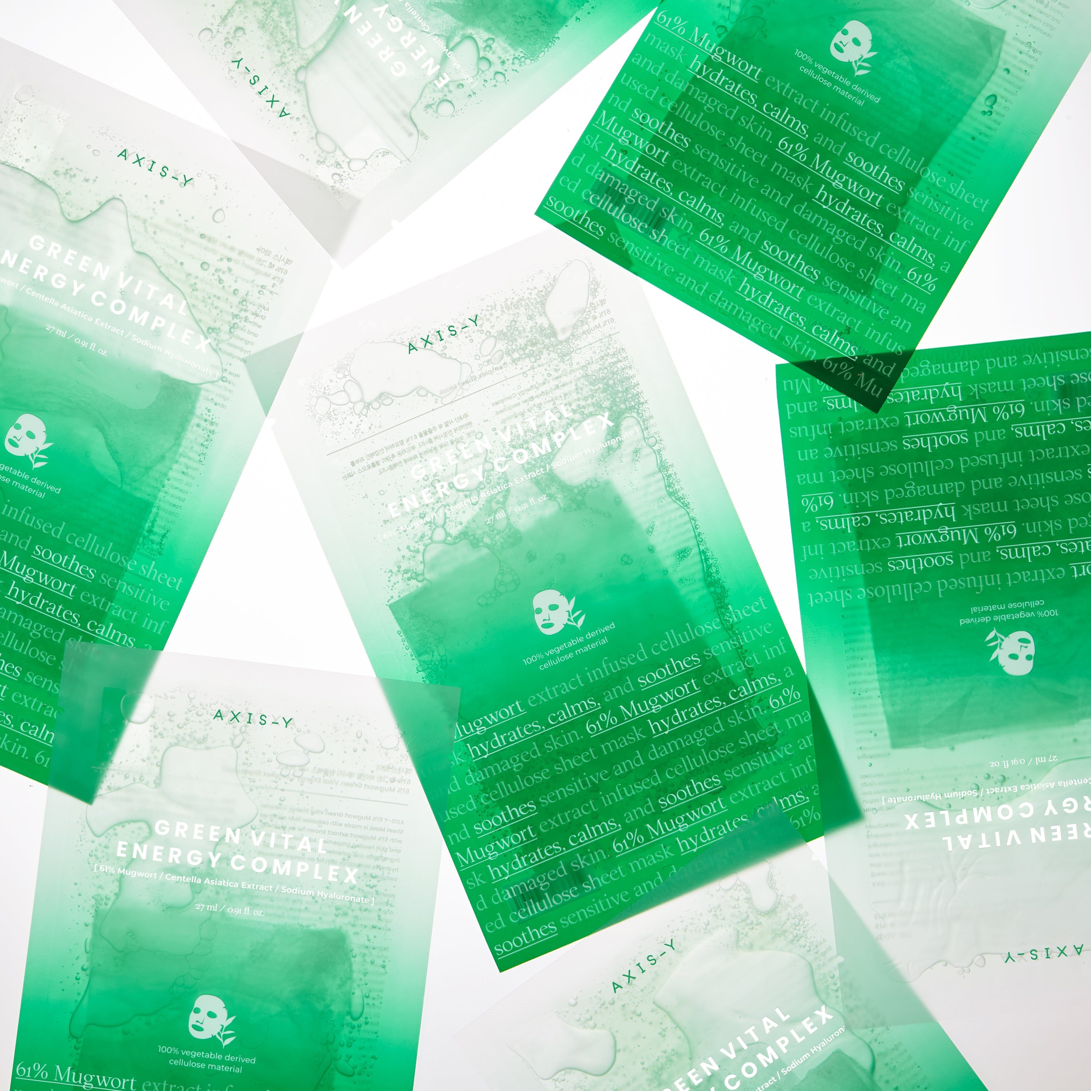 Diverse confezioni di maschere verdi su sfondo bianco. AXIS-Y in alto. Testo: GREEN VITAL ENERGY COMPLEX.