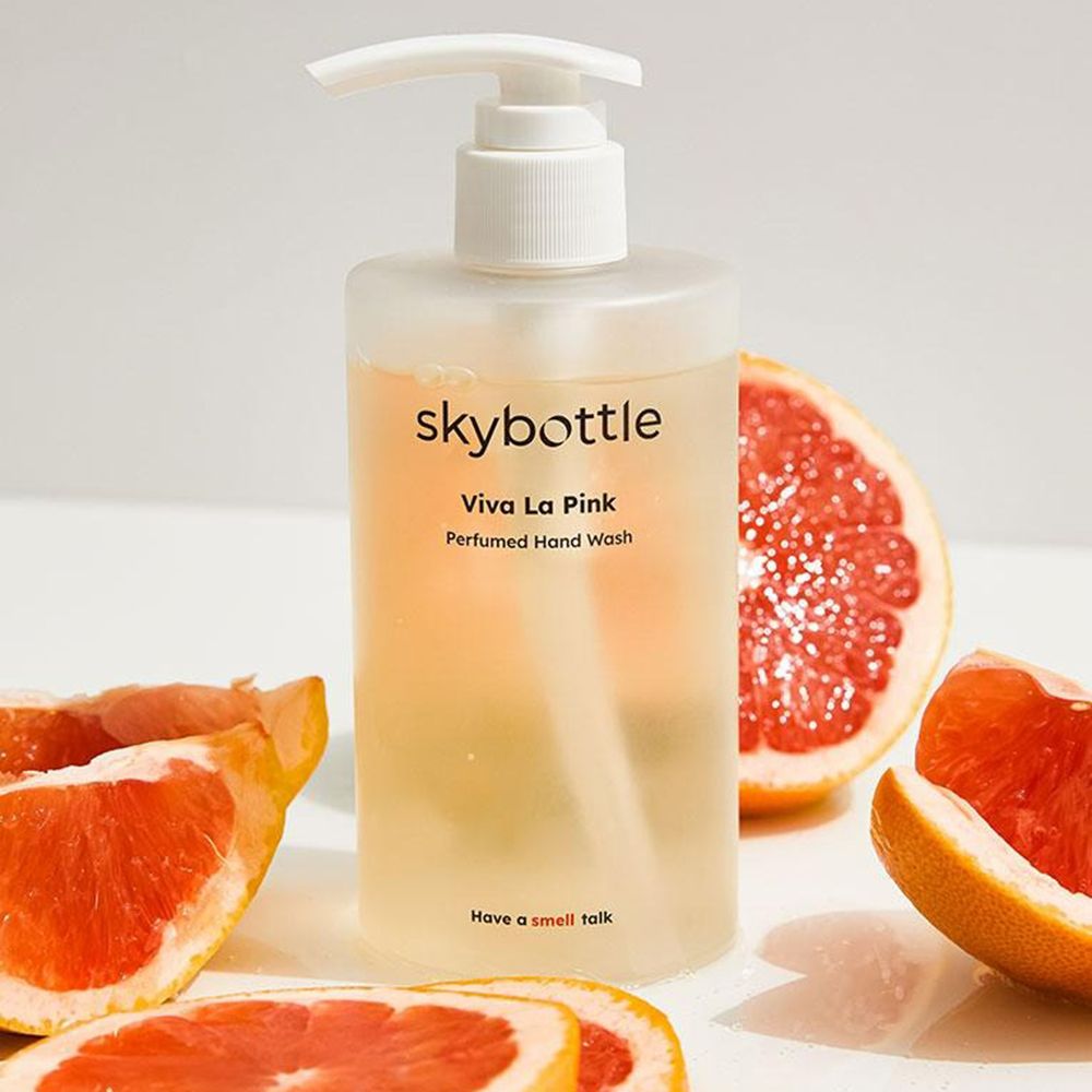 Sapone liquido SKYBOTTLE Viva La Pink con pezzi di pompelmo. Bottiglia trasparente con dispenser.