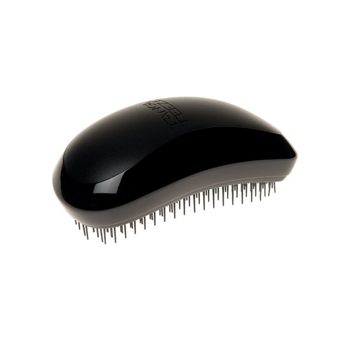 Spazzola per capelli Tangle Teezer nera. Ovale, con setole nere. Marchio in rilievo sulla parte superiore.