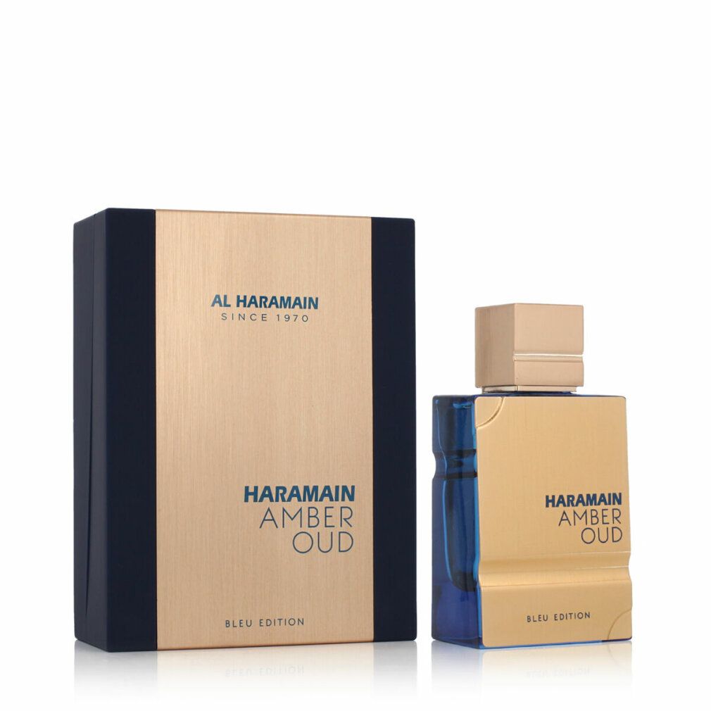 Flacone di profumo dorato con tappo dorato e base blu. Confezione rettangolare con logo del marchio e nome del prodotto.