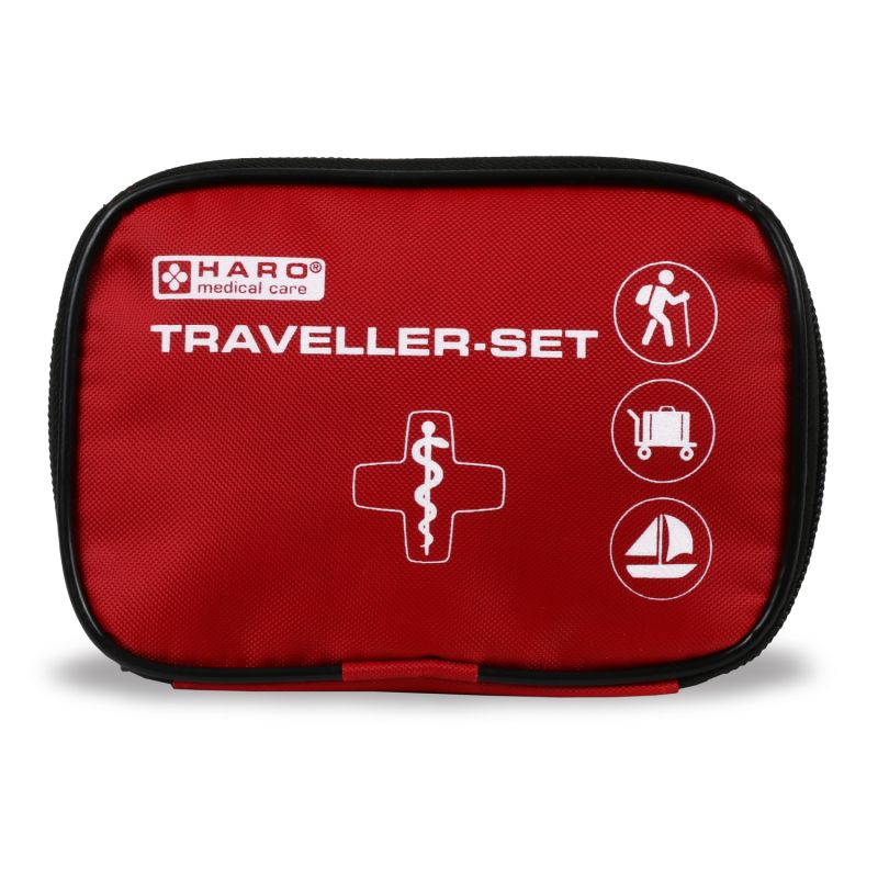 Borsa di pronto soccorso rossa con cerniera nera. Scritta: HARO medical care, TRAVELLER-SET. Simboli: escursionista, valigia, barca a vela.