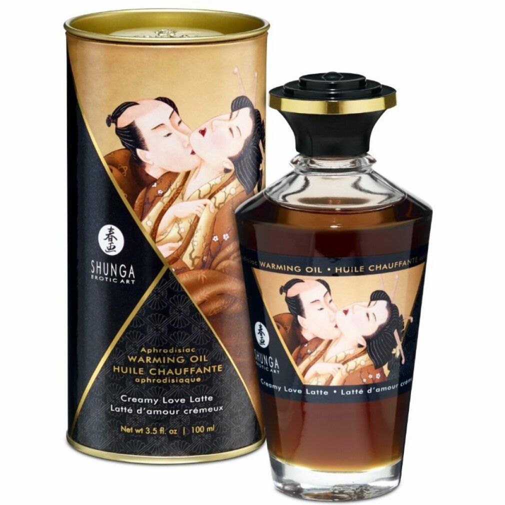 Flacone e scatola con illustrazione. Scritta: Shunga, Warming Oil, Creamy Love Latte. Scatola con design nero e oro.