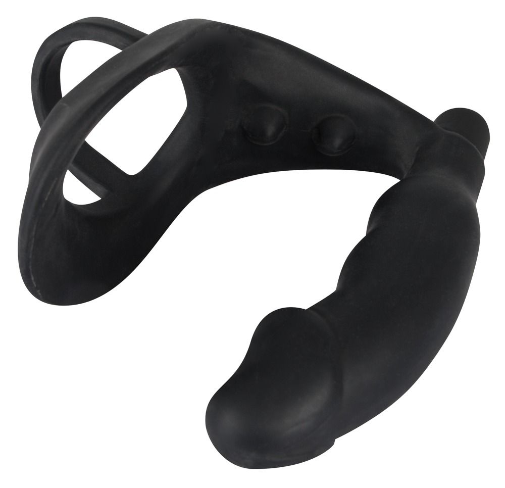 Anello per pene/scroto nero con plug anale. Parte ad anello, asta curva con forma di pene, plug anale all'estremità. Silicone.