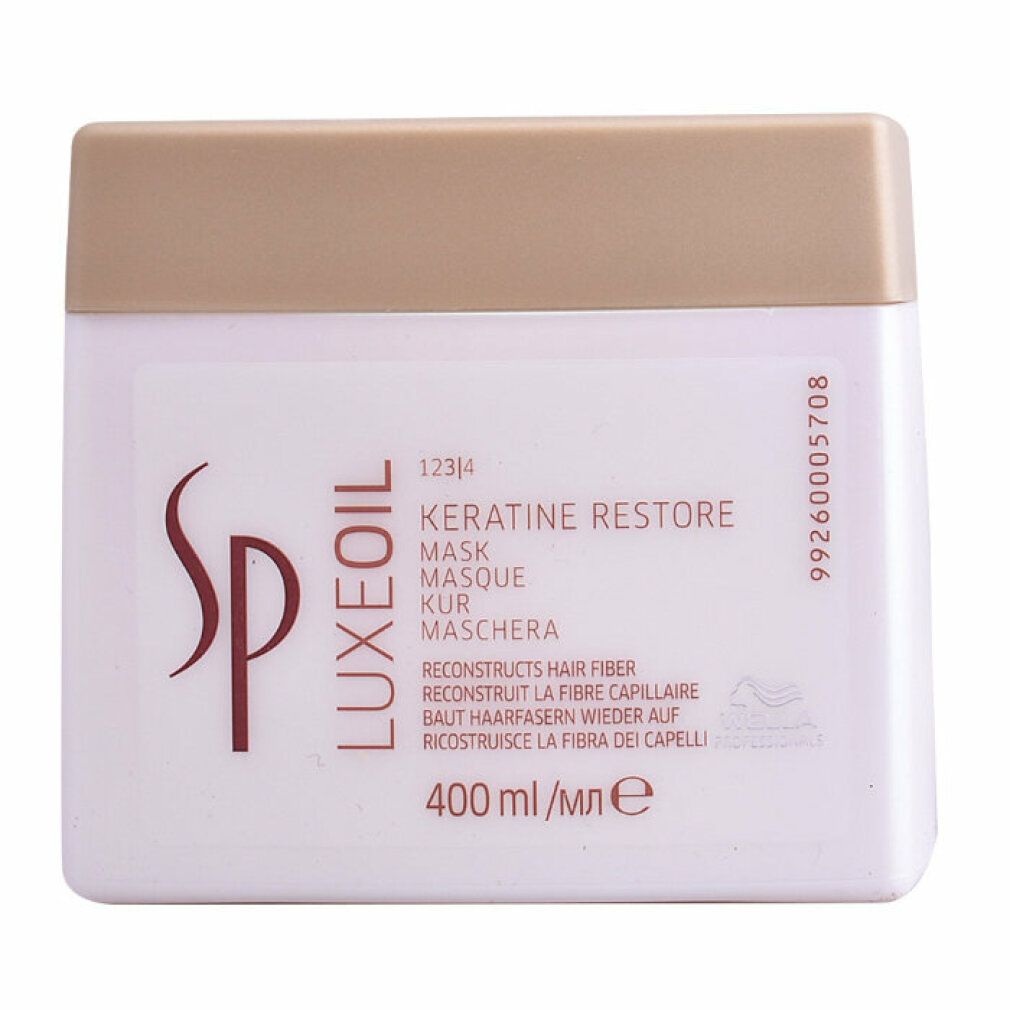 Vaso bianco con coperchio dorato. Scritta: SP Luxeoil Keratin Restore Mask. 400 ml.