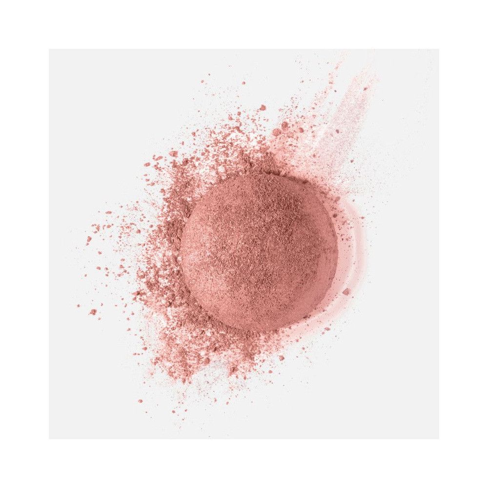 Cipria rosa rotonda con polvere. Sfondo bianco.
