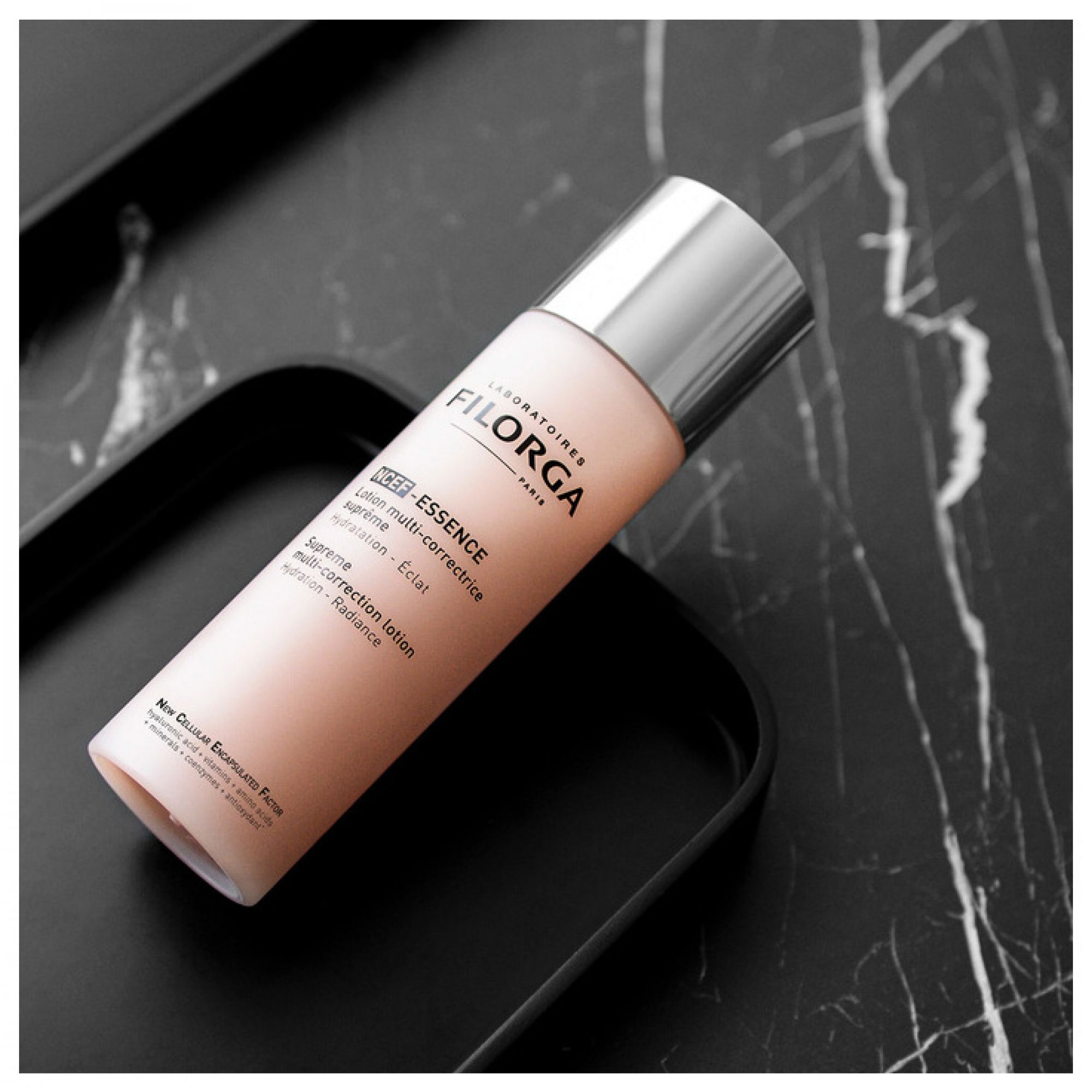 Lozione Filorga NCEF Essence su base nera.