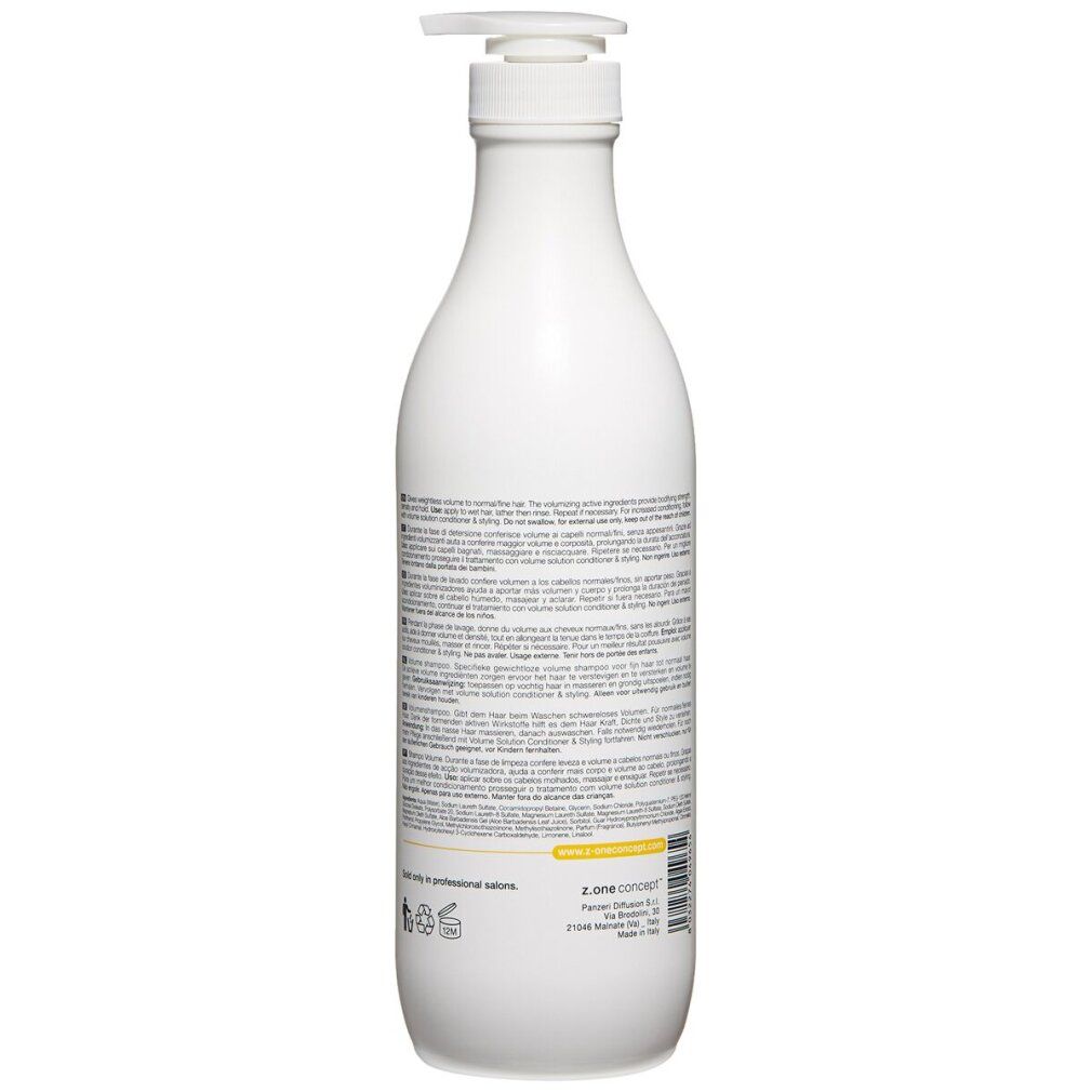 Retro di un flacone di shampoo bianco. Testo in più lingue. Nome del prodotto e logo non visibili.