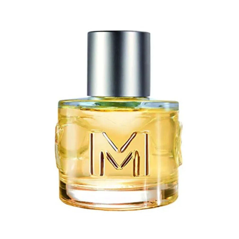 Flacone in vetro di MEXX Woman Eau de Toilette. Forma cilindrica, tappo argentato. Scritta 'M' sul flacone.