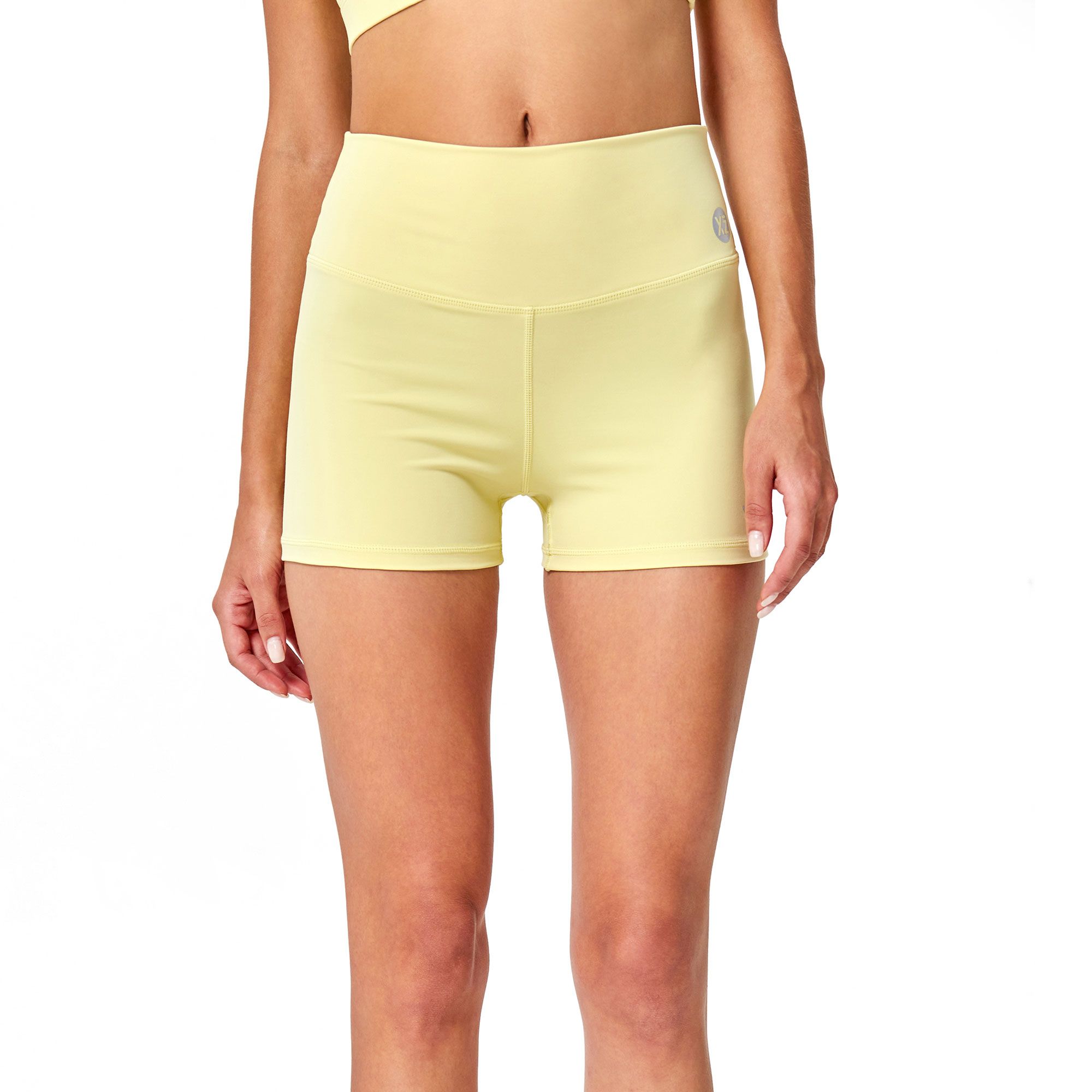 Pantaloncino sportivo giallo pallido a vita alta.