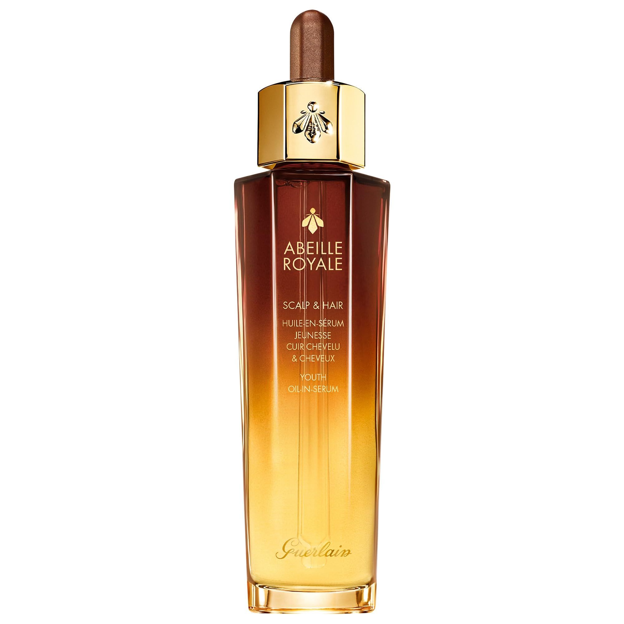 Flacone marrone e dorato con scritta "ABEILLE ROYALE". Con contagocce e tappo dorato. Marchio Guerlain.