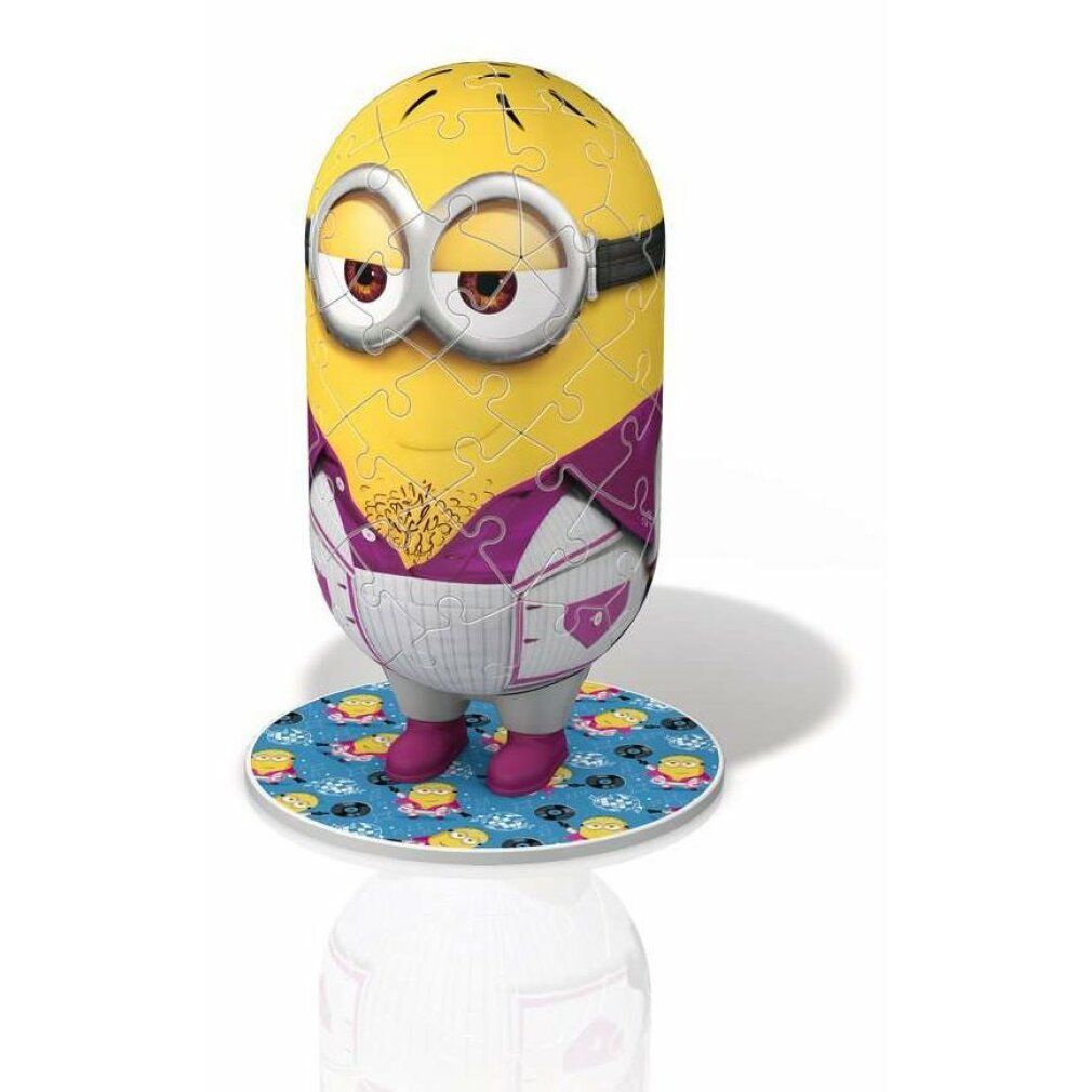 Puzzle 3D Minion assemblato. Personaggio giallo con occhiali, giacca viola e scarpe rosa. In piedi su una base rotonda.