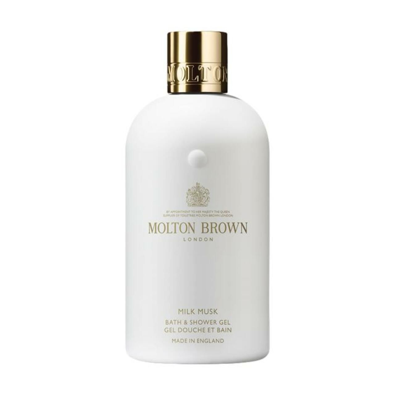 Flacone bianco Molton Brown con tappo dorato, bagnoschiuma e docciaschiuma Milk Musk.
