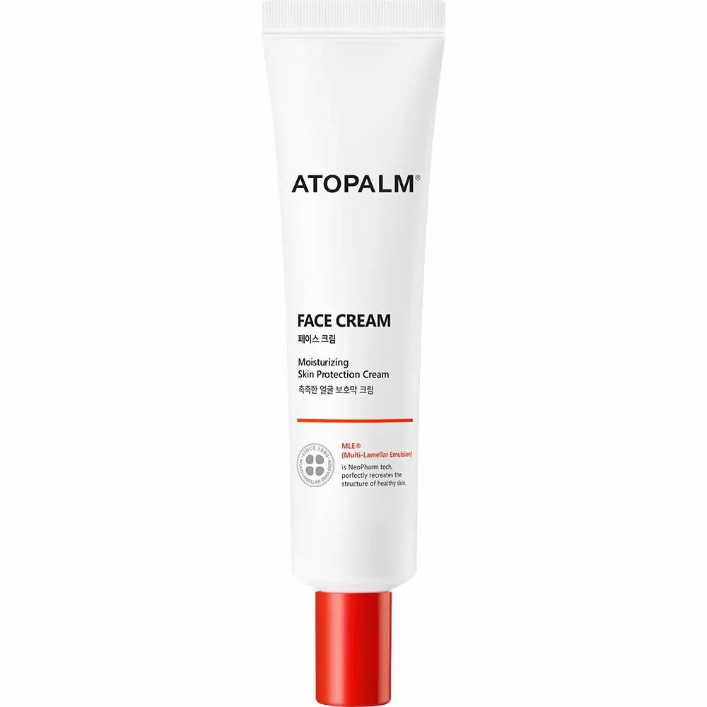 Tubo bianco con tappo rosso. Scritta ATOPALM FACE CREAM. Informazioni sul prodotto.