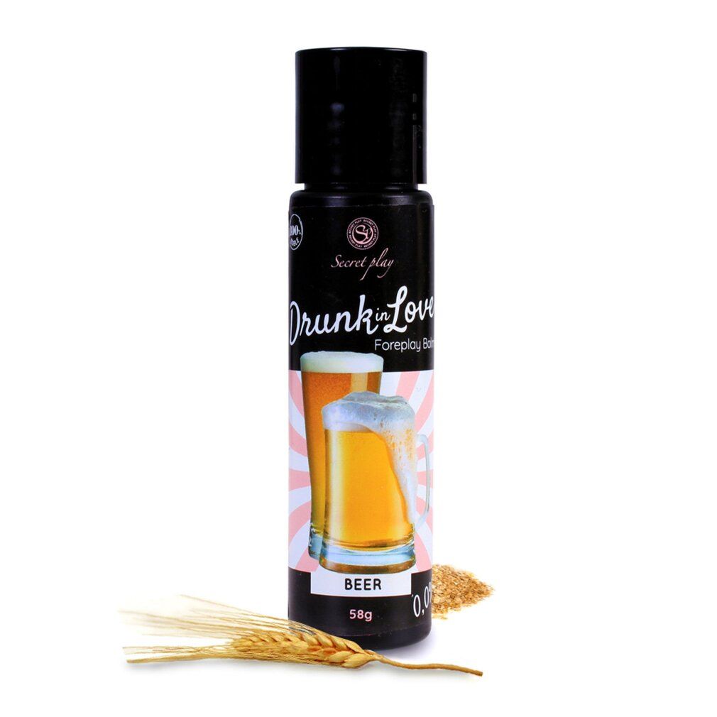 Flacone nero con "Drunk in Love Foreplay Balm". Immagine di birra. Scritta "BEER". Spighe e granaglie accanto.