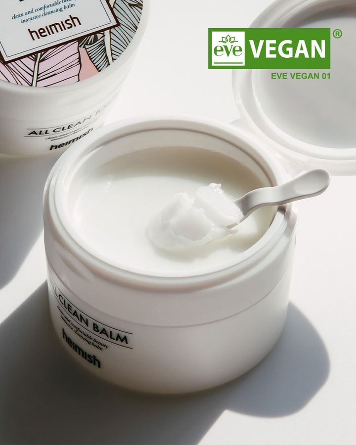 Vasetto bianco con prodotto. Cucchiaio con prodotto. Scritta "ALL CLEAN BALM" e "heimish". Sigillo vegano.
