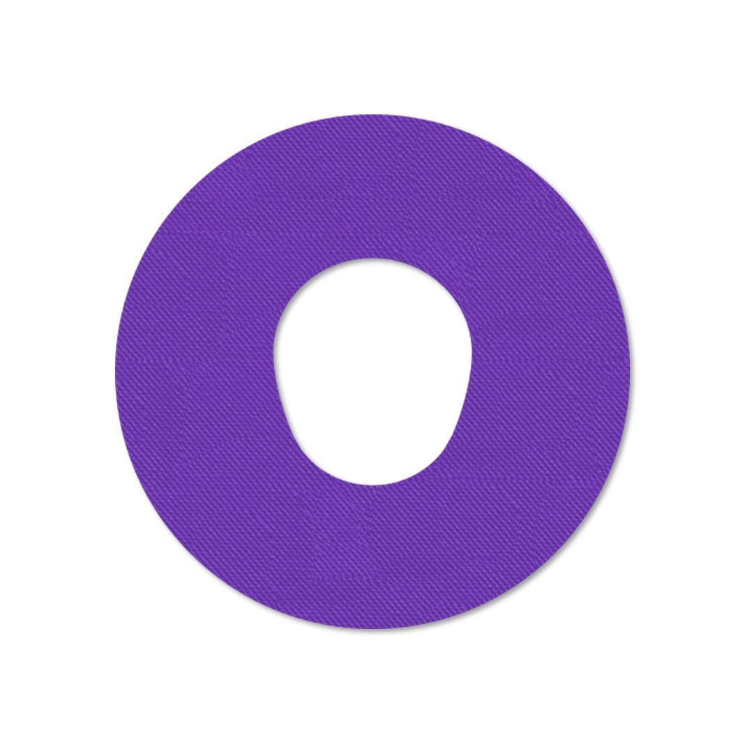 Cerotto di fissaggio rotondo viola con foro centrale. Superficie tessile.