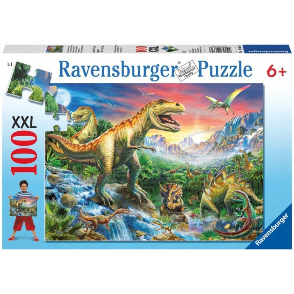 Scatola puzzle con dinosauri. Scritta: Ravensburger Puzzle, 100 pezzi, XXL. Età consigliata: 6+.