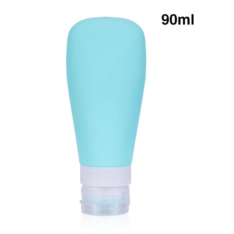 Un singolo flacone da viaggio in silicone turchese da 90 ml con tappo bianco e trasparente.