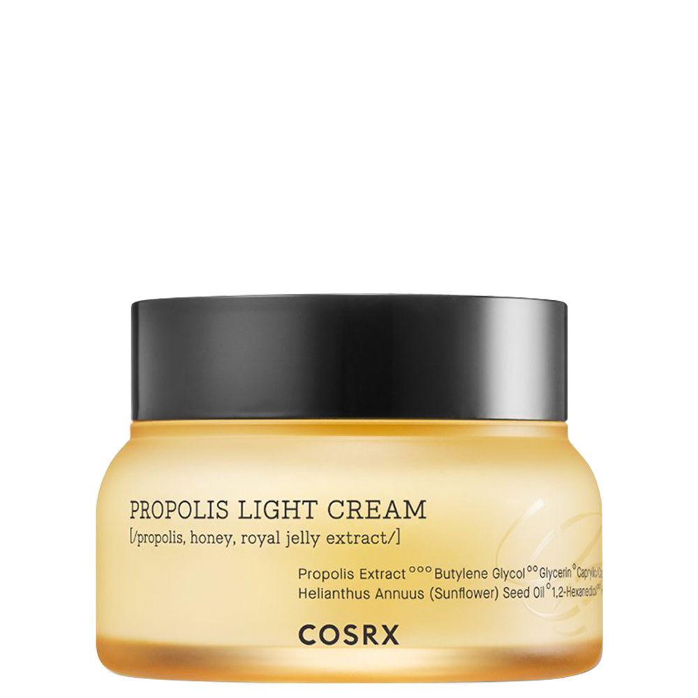 COSRX Propolis Light Cream in un barattolo di vetro giallo con coperchio nero.