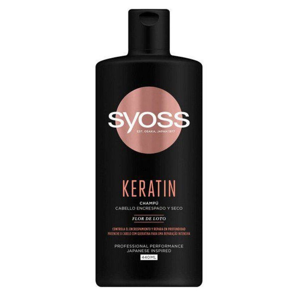 Flacone di shampoo nero con logo rosa. Scritte: Syoss, Keratin, Cabello Encrespado y Seco, Flor de Loto. Professional Performance, Japanese Inspired. 440ml.