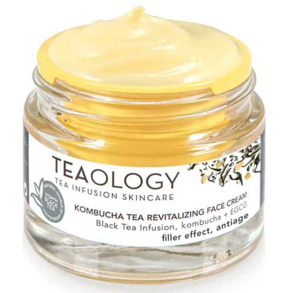 Vasetto di vetro con crema giallastra. Scritta: Teaology, Kombucha Tea Revitalizing Face Cream. Tè nero, kombucha + EGCG.