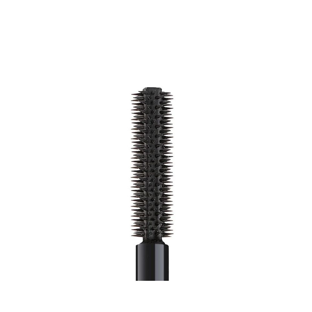 Primo piano di uno scovolino per mascara. Setole nere.