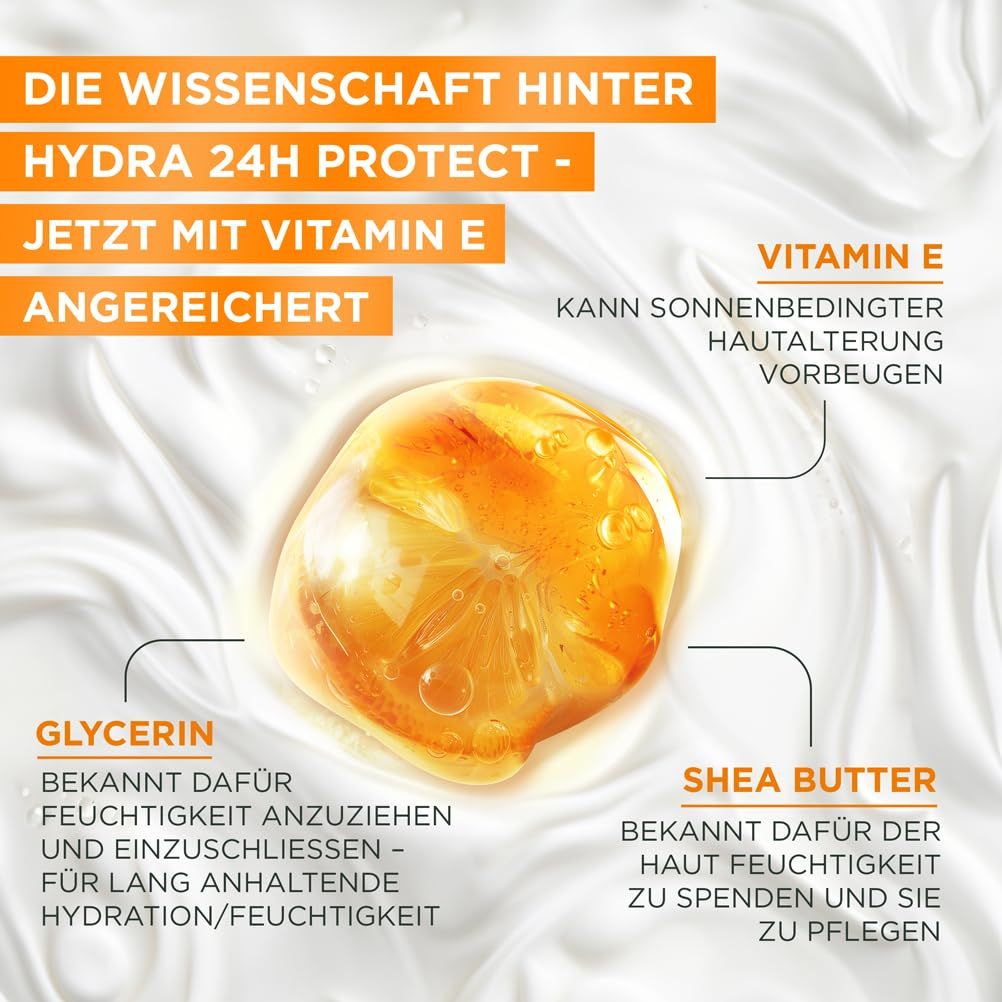 Primo piano della crema. Testo: Vitamina E, Glicerina, Burro di Karité. Garnier Hydra 24H Protect+.