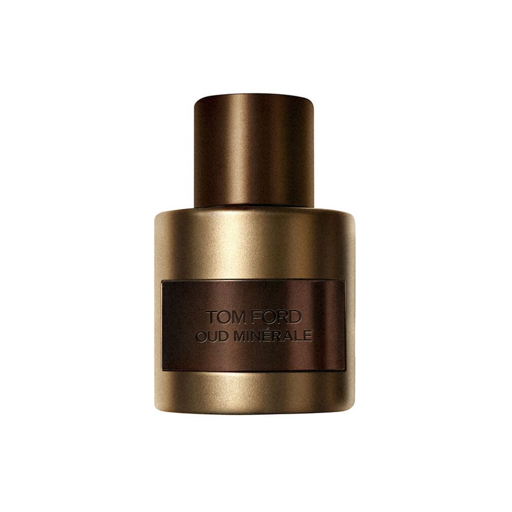 Flacone di profumo dorato con tappo marrone. Forma rettangolare con etichetta marrone. Testo: TOM FORD OUD MINÉRALE.
