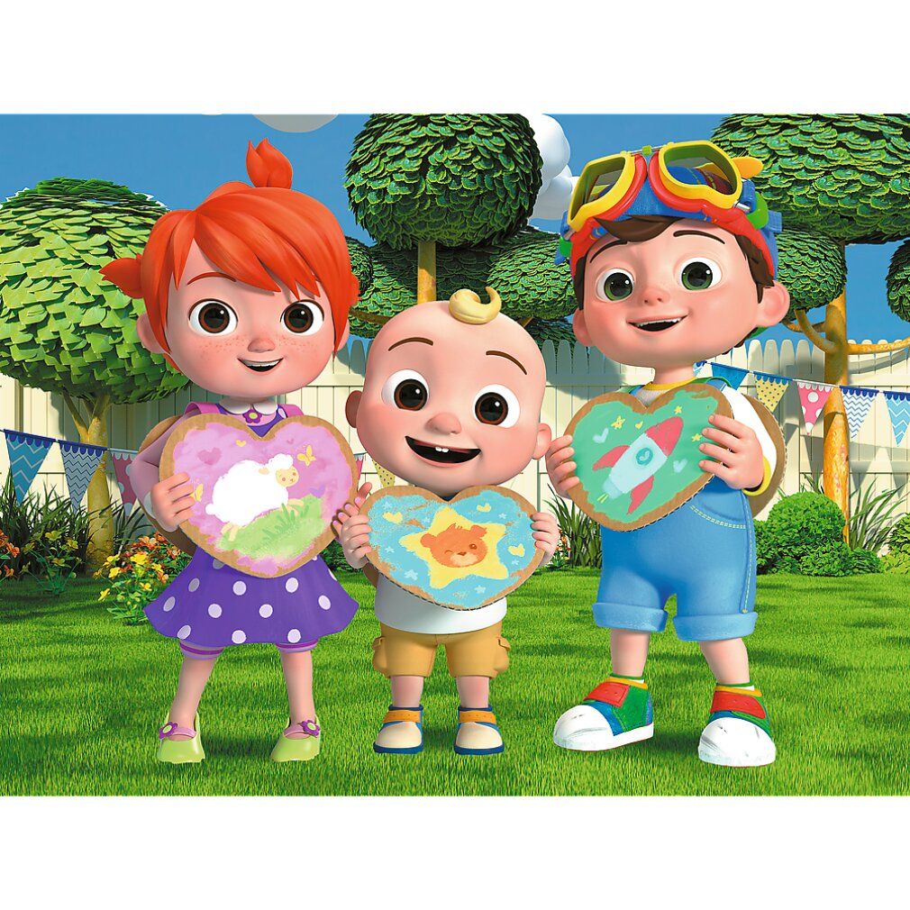 Tre personaggi di Cocomelon tengono pezzi di puzzle a forma di cuore. Sfondo: erba verde, alberi e recinzione. I personaggi indossano abiti.