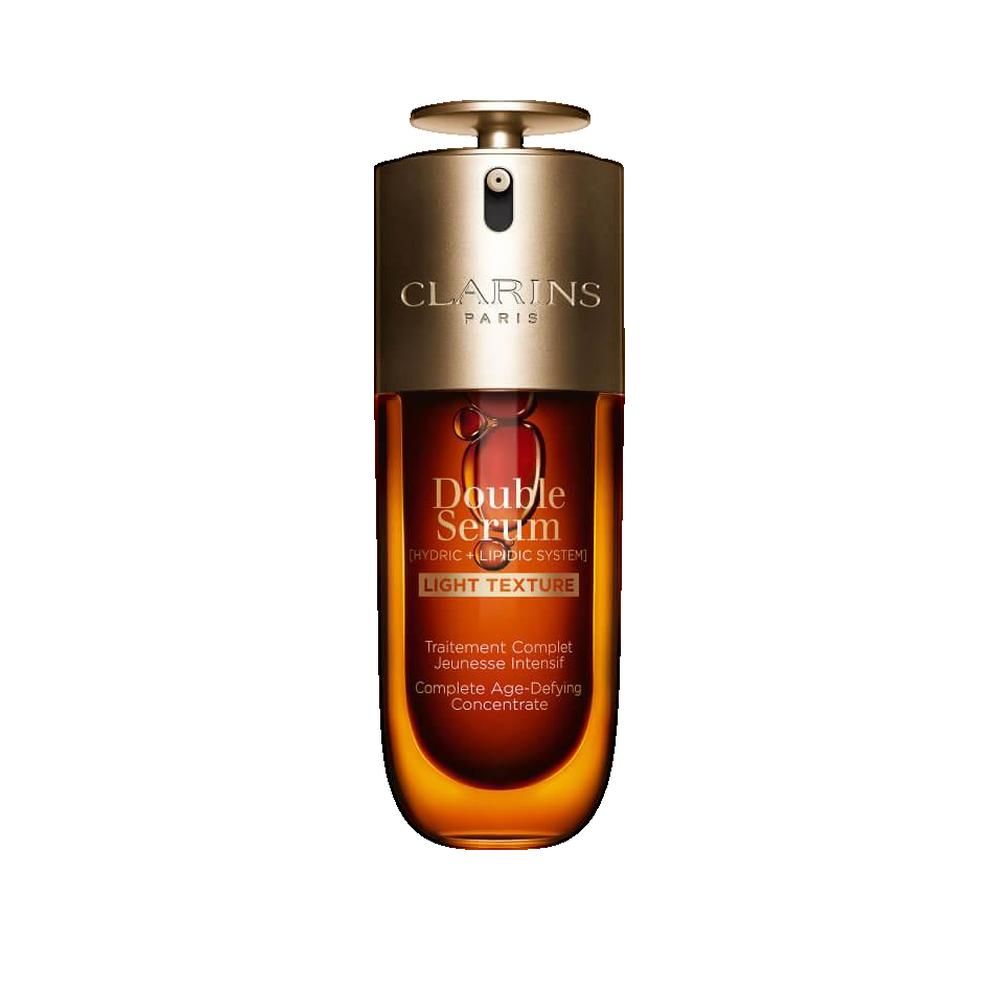 Flacone marrone con tappo dorato. Scritte: Clarins Paris, Double Serum, Light Texture. Contiene liquido.